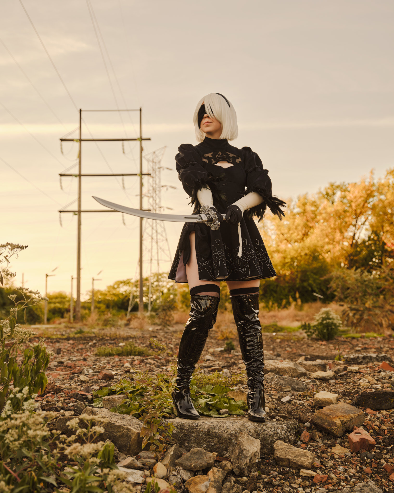 Rogue Heart Cosplay standing on a rock dressed as 2B from Nier: Automata.